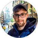 Person smiling on city street